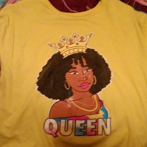 A yellow shirt with a black woman it says queen